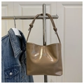 Detail of khaki shiny PU shoulder bag with silver bow emblem and knotted strap design - Khaki (Without Charm)
