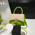 Green and beige patchwork crossbody bag with golden buckle and woven texture - Green