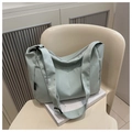 Minimalist mint green nylon crossbody bag with adjustable wide strap and large capacity - Green