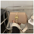 Detail of beige shoulder bag with gold buckle and stylish geometric patterned wide strap - Khaki