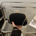 Black woven evening clutch with diamond-encrusted lock and gold chain strap - Black