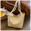 Beige straw woven tote bag with white lace bow and thick rope handles for beach vacation - Khaki