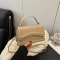 Minimalist beige leather crossbody bag with wavy flap and golden hardware for women - Khaki