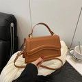 French style brown caramel shoulder bag with unique wavy stitching and gold hardware - Brown