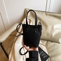 Minimalist black pebble leather mini bucket bag with pendant and adjustable strap - Black (No Pendant)