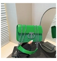 Detail of green leather handbag with silver chain strap and shiny sequin texture - Green