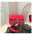 Detail of red leather and sequin shoulder bag with T-shaped silver buckle and chain - Red