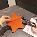 Oranje stervormige portemonnee van kiezelleder met een kleurrijke gevlochten polsband - Oranje