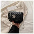 Fashionable black quilted chain crossbody bag with a large sparkling star rhinestone detail - Black