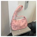 Close-up of pink underarm bag with bamboo leaf print and silver zipper detail - Pink