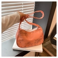 Orange half-moon shoulder bag with bamboo leaf print and silky nylon finish - Orange