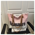 Close-up of pink tassel trim on a gradient canvas beach tote with Summer print - Light Pink