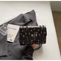 Chic black crossbody bag with cherry print, metal chain strap and luxury lock detail - Black
