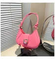 Close-up of pink crescent underarm bag showing glossy PU leather and golden D-buckle - Pink