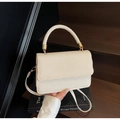Creamy white underarm bag with woven texture and wavy edge for elegant styling - Off White