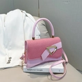 Pink hourglass handbag with woven texture flap and gold D-buckle closure detail - Pink