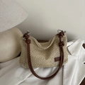 Borsa tote in paglia intrecciata beige con cinturini in pelle marrone e anelli in metallo - Marrone