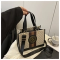 Detail of a large tote bag featuring old-flower texture and chic color stitching - Black