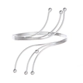 Detail of silver multi-layer spiral arm cuff featuring polished spherical end beads - Silver