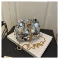 Silver sequin bucket bag featuring gold chain drawstring and elegant pearl accents - Silver