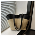 Detail view showing textured straw and black leather patchwork on a modern tote bag - Large / Khaki Black