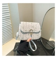 Detail of straw saddle bag with floral embroidery and gold horseshoe metal buckle - Off White