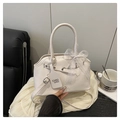 Detailed shot of white Boston bag featuring lace bow decoration and silver metal hardware - White