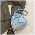 Detail of light blue PU leather mini backpack with large decorative bow accent - Blue
