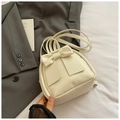 Detail of cream mini backpack with large decorative bow on soft faux leather surface - Off White