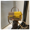 Detail van kaki en gele patchwork Kelly-tas met gouden metalen draaisluiting en hendel - Geel