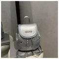 Close-up of silver backpack showing metallic crinkle texture, cute embroidery and chain detail - Silver