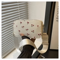 Detail of white camera bag with red cherry prints and wide fabric shoulder strap - White