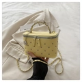 Pale yellow quilted leather box bag with studs and a metallic rose charm - Yellow