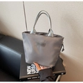 Detail of grey water-resistant nylon handbag with FASHION label and zip closure - Dark Gray