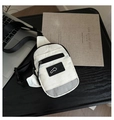 Detail of white nylon crossbody bag with black mesh pocket on a dark office desk - White