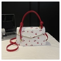 Mini white crossbody bag with cherry prints and vibrant red handles and strap - Red