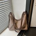 Brown herringbone tote bag with dark brown handles and front zipper in a minimalist setting - Khaki