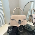 Elegant apricot trapezoid handbag with silver twist lock and round top handle - Khaki