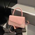 Roze patchwork crossbodytas met geweven textuur en goudkleurig mode-tekstlogo - Roze