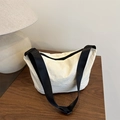 Minimalist cream white dumpling crossbody bag with contrasting black nylon shoulder strap - White