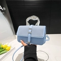 Light blue crossbody bag featuring woven texture flap and silver geometric metal handle - Blue