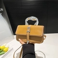 Chic camel leather and yellow woven crossbody bag featuring a unique silver fluid metal handle - Brown
