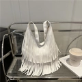 Chic white fringe tote bag for women with long tassels in a stylish lifestyle setting - White