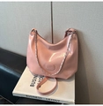 Detail of pink patent leather crescent bag featuring silver chain and oval logo emblem - Pink (No Charm)