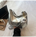 Silver metallic hobo tote bag with a plush charm accessory on a white bedding background - Silver (With Pendant)