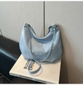 Detailed view of light blue patent leather crescent tote bag with silver chain strap - Blue (Without Charm)