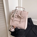 Pink bow-knot backpack for women with pearl heart pendant and fashion text detail - With Pendant / Pink