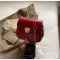 Glossy red patent leather crossbody bag with a decorative gold heart lock and chain strap - Burgundy