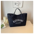 Borsa tote nera in tela con scritte bianche e manici decorativi in corda intrecciata - Nero