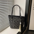 Elegant black tote bag featuring white floral embroidery and a white tassel pendant detail - With Pendant / Black